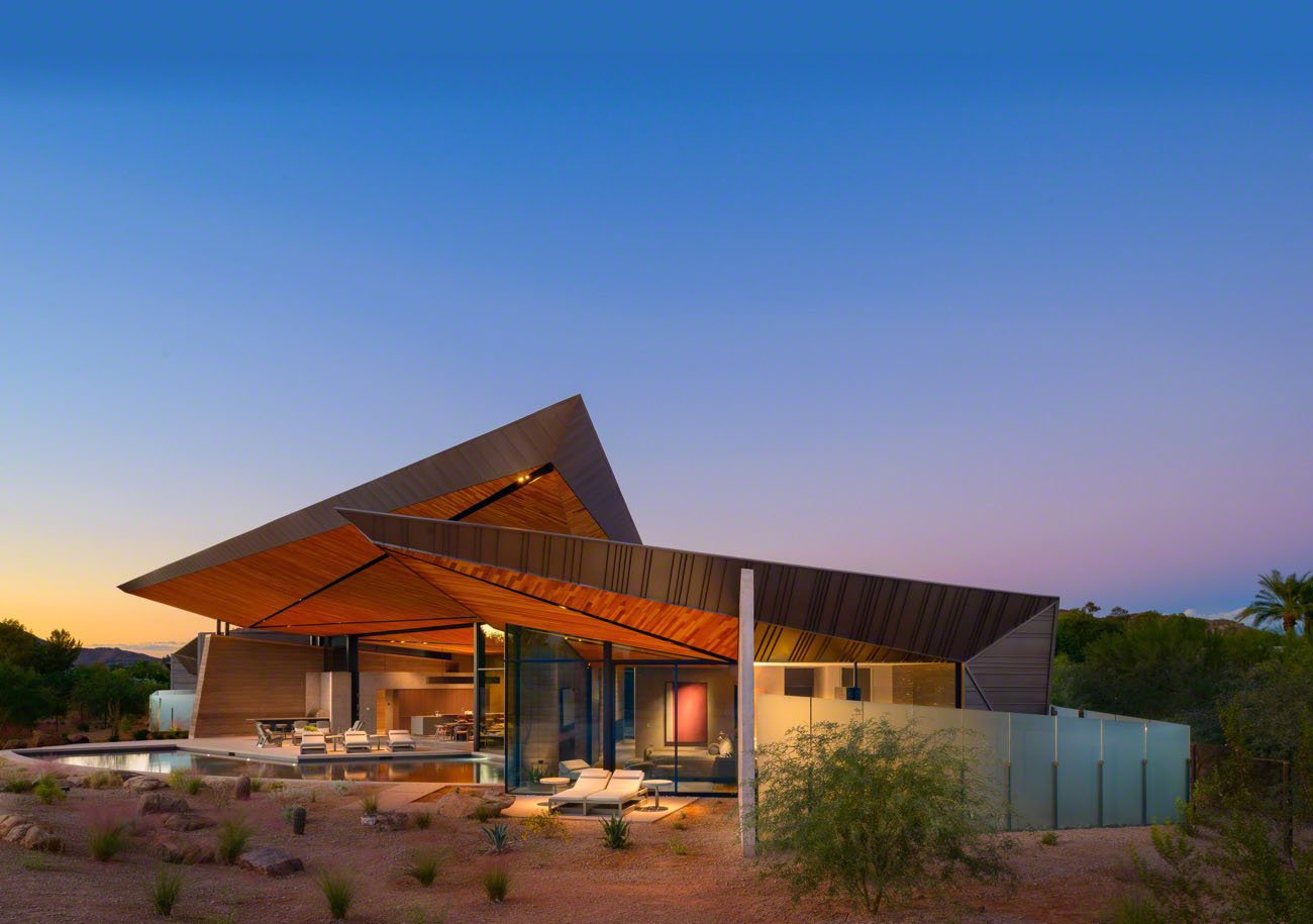 House with angular architecture and pool in a desert location